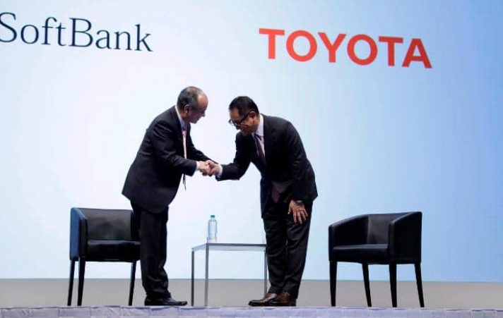 Masayoshi Son, chairman and chief executive officer of SoftBank Group Corp., left, shakes hands with Akio Toyoda, president of Toyota Motor Corp., during a news conference in Tokyo, Japan, on Thursday, Oct. 4, 2018. Japan's??SoftBank and??Toyota are teaming up on ride-hailing and self-driving cars as they accelerate their push into a market dominated by U.S. technology and car companies. Photographer: Kiyoshi Ota/Bloomberg via Getty Images